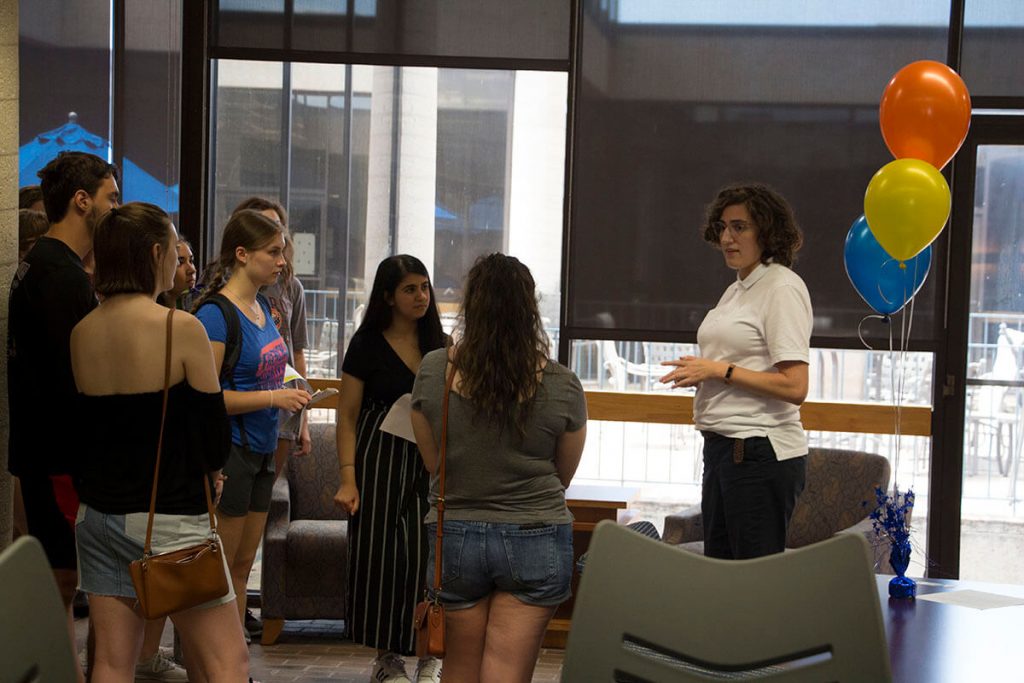 Alex Gallin-Parisi with students in the Library