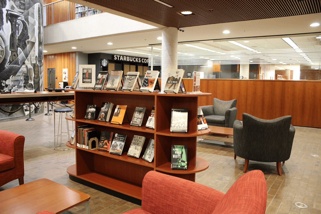 Library lobby with book display and Starbucks in the background
