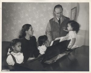 Charles Drew with his wife Lenore and their three daughters at the piano