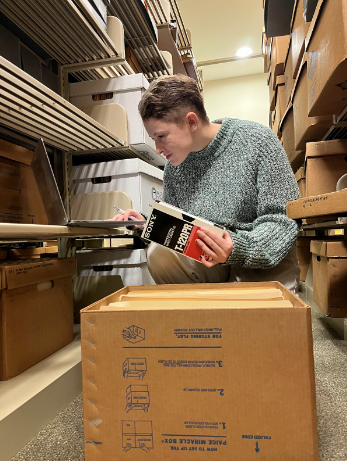 Chris in the archives shelves.